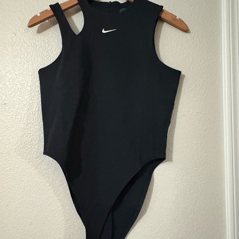 Nike Black Sleeveless Bodysuit NWT
Size M. Cute shoulder cutout detail. Stretchy - Picture 2 of 16